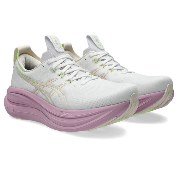 White running shoes with pink sole on a white background