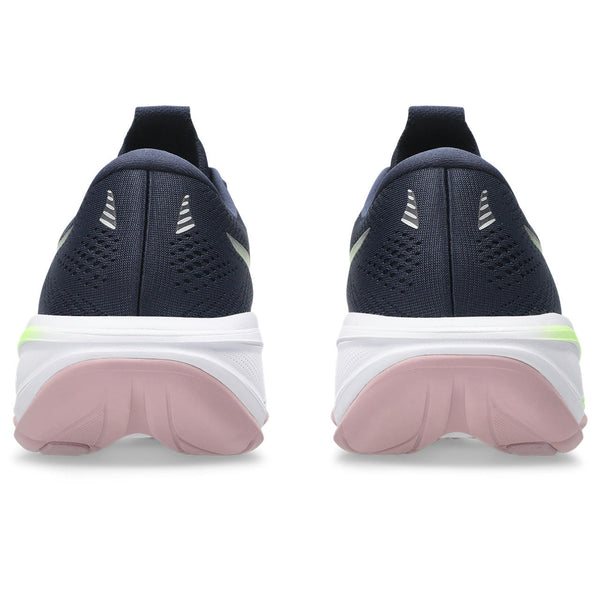 Navy running shoes with pink soles on a white background