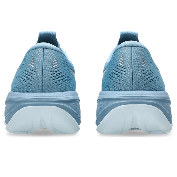 Blue running shoes shown from the back on a white background