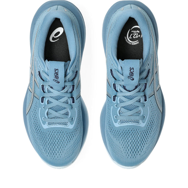 A pair of tonal blue running sheos with blue laces and an ASICS tab on top.