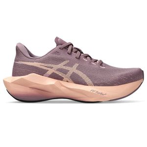 Purple running shoe with a beige sole on a white background