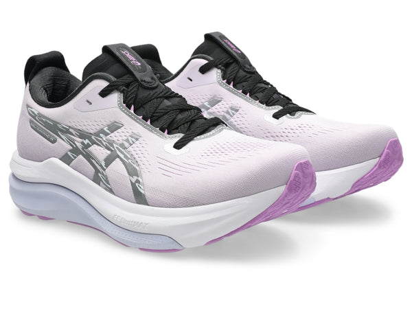 Purple and black running shoe on a white background