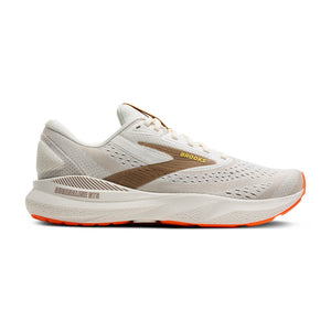 This Adrenaline GTS 24 has a off-white upper and midsole with brown and orange accents. 