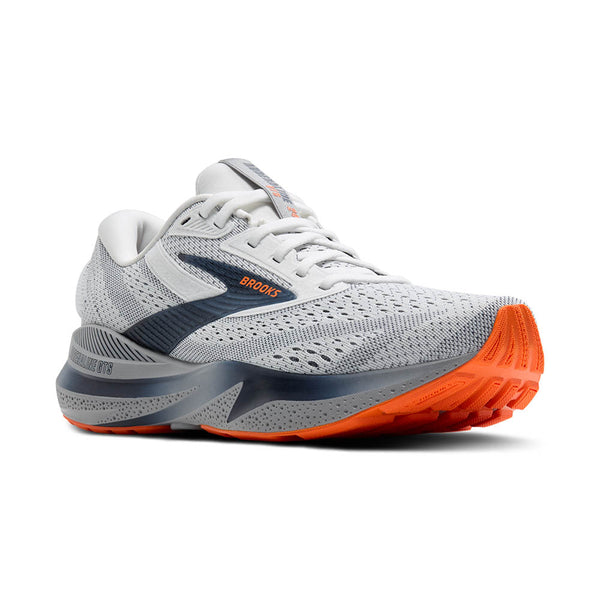 Gray and orange running shoe with 'Brooks' branding on a white background.