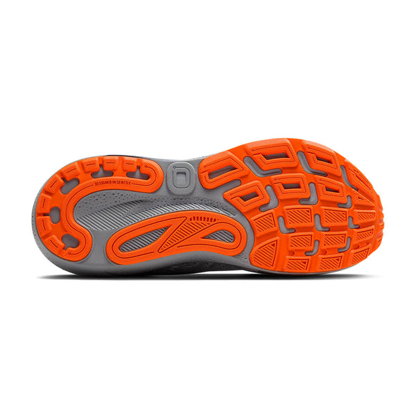 Close-up of a men's brooks running shoe's sole with orange and gray design on a white background.