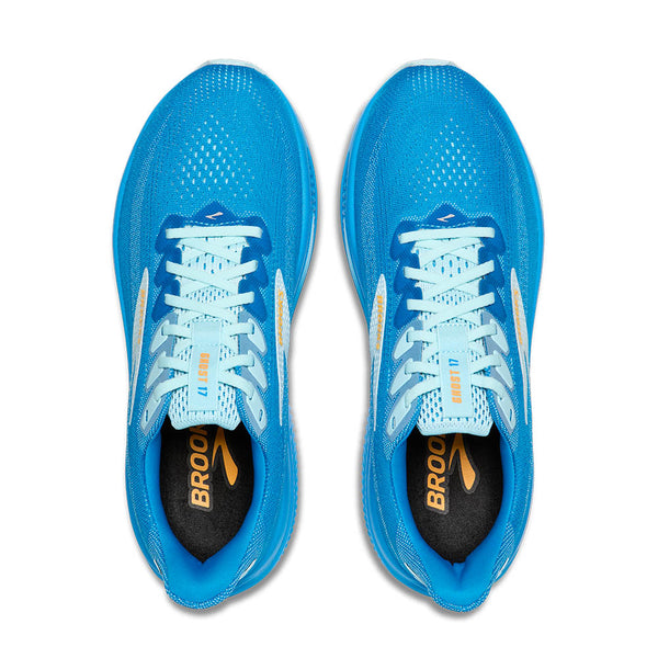 Pair of blue running shoes with white laces on a light gray background
