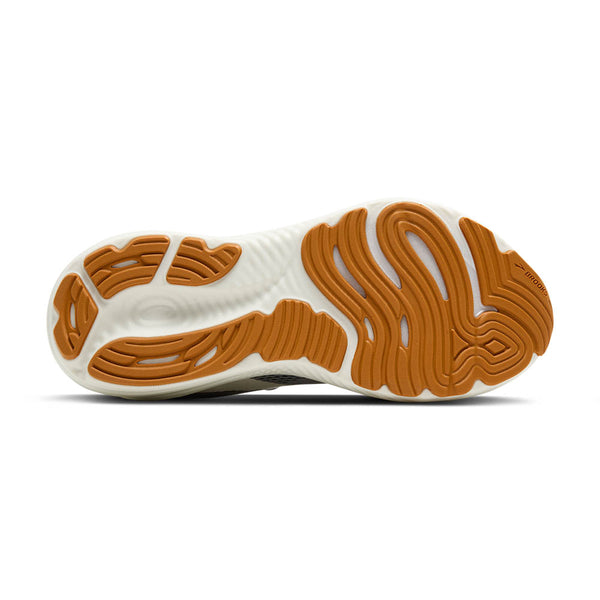 Tan rubber is used on the outsole of the shoe to contrast the white midsole. 