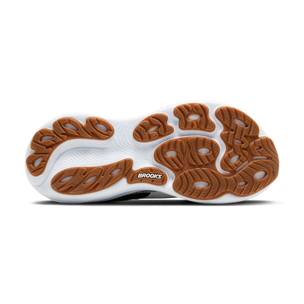 Close-up of a shoe sole with brown tread pattern on a white background