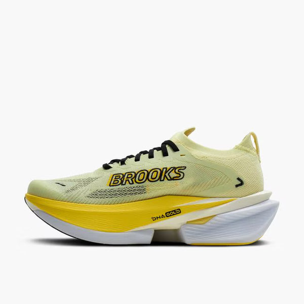 Yellow running shoe with black accents on a white background