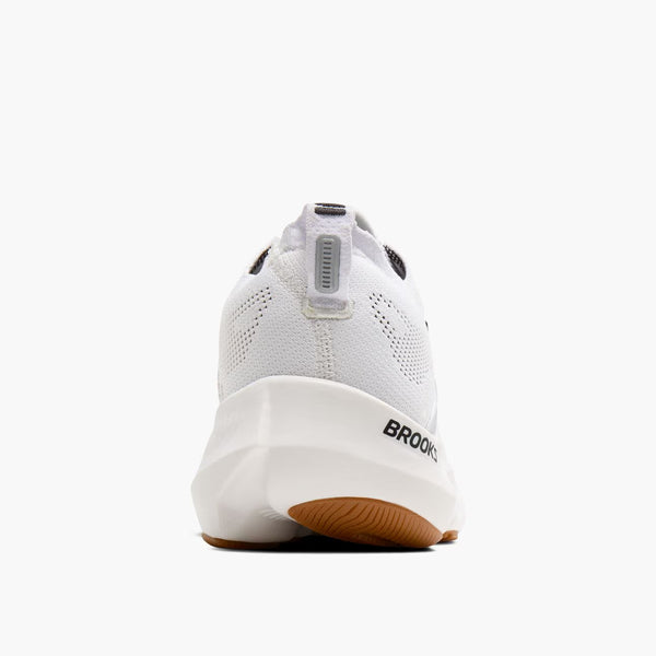White running shoe with 'Brooks' branding on a white background