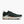 A dark green running shoe with a white midsole and orange outsole accents, shown on a light gray background.