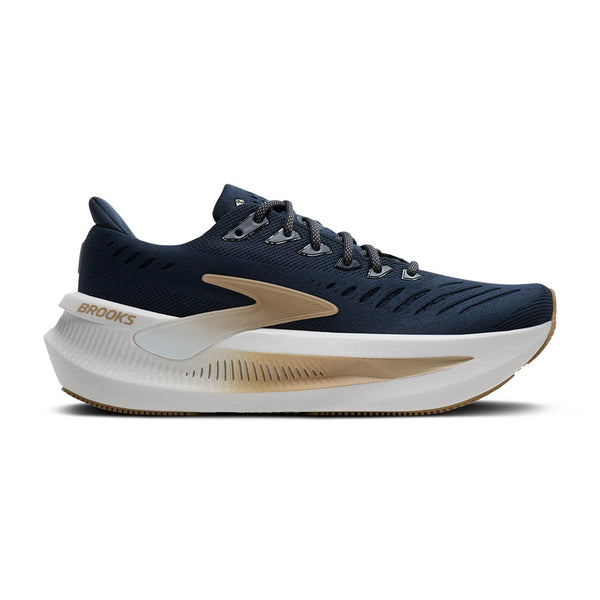 Navy Brooks running shoe with white sole on a white background.