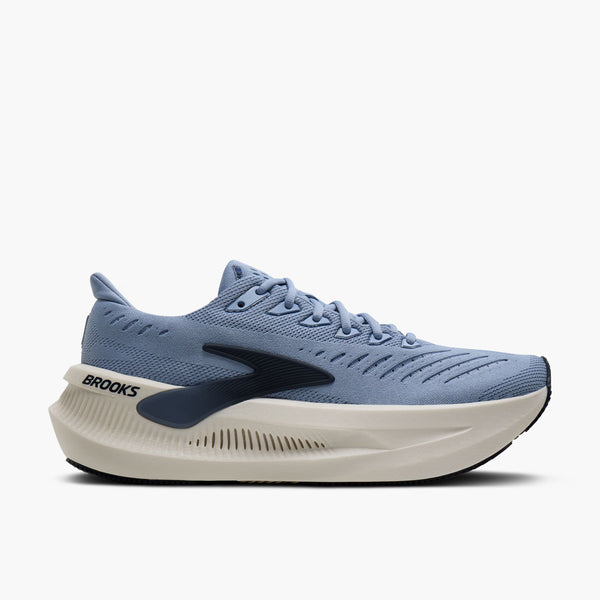 Blue running shoe with white sole on a white background