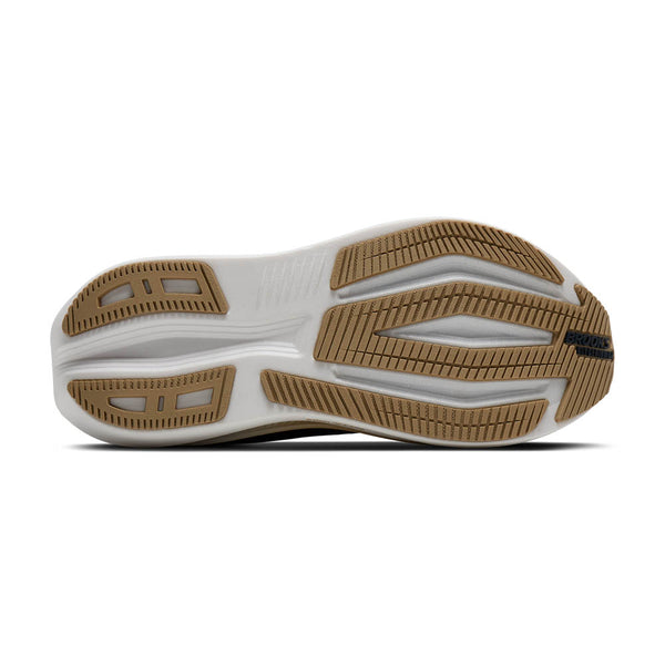 Close-up of a shoe sole with brown and white design on a white background