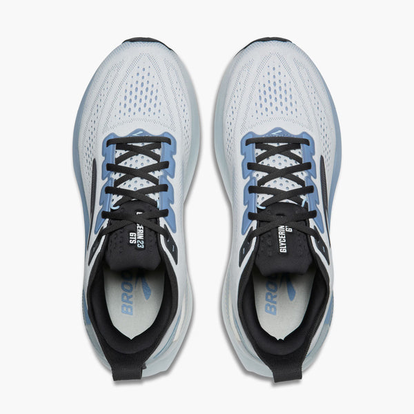 A pair of Brooks Ghost running shoes shown from a top-down view, featuring a white and light blue mesh upper with black laces and black branding details.
