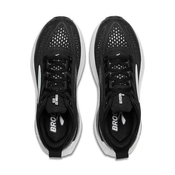 A pair of men's brooks running shoes in a core black and white colorway.
