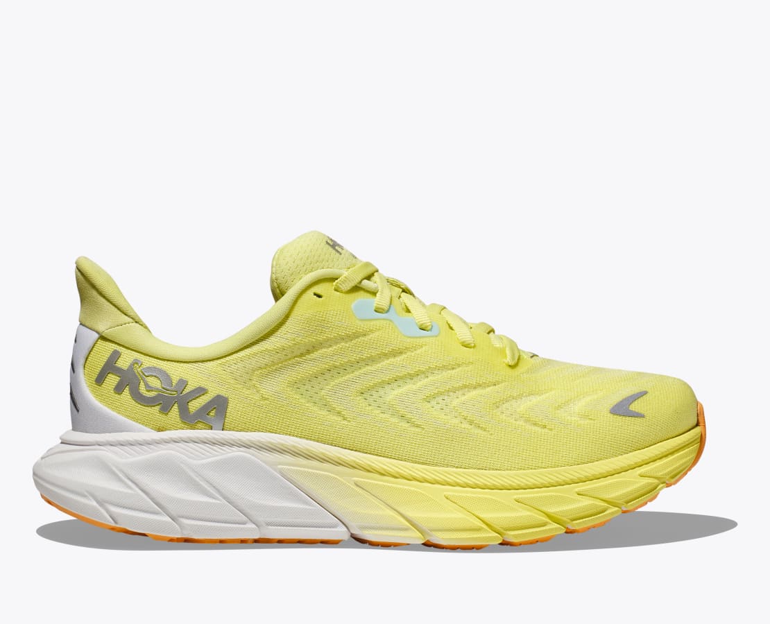 Lateral view of the Women's Arahi 6 by HOKA in the color Citrus Glow/White