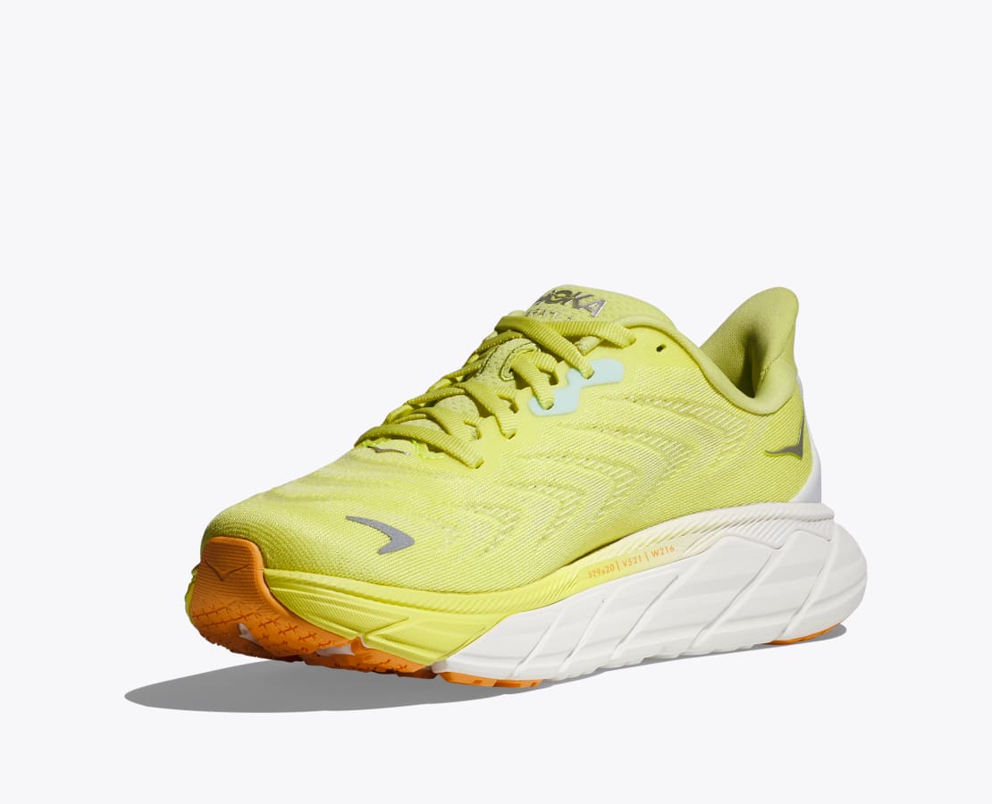 Medial view of the Women's Arahi 6 by HOKA in the color Citrus Glow/White