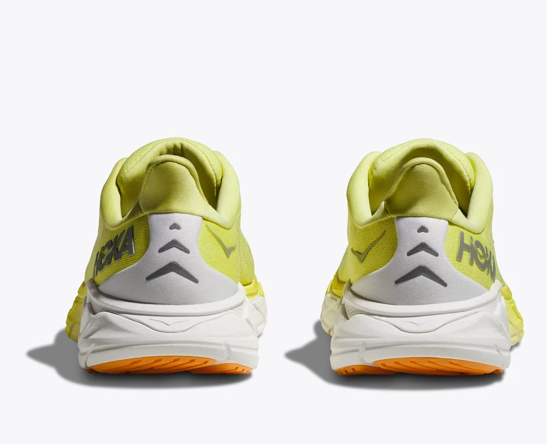 Back view of the Women's Arahi 6 by HOKA in the color Citrus Glow/White