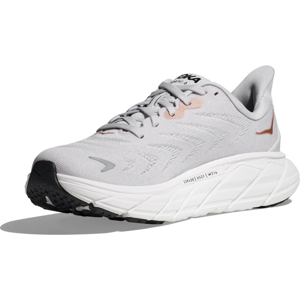 Medial view of the Women's Arahi 6 by HOKA in the wide D width, color Nimbus Cloud/Rose Gold