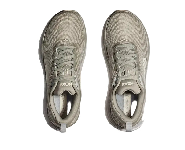 Pair of gray running shoes with 'Hoka' branding on a white background