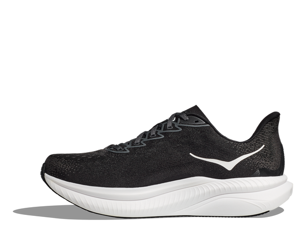 A large Hoka logo is stitched near the ankle on the medial side of the upper in white thread. 