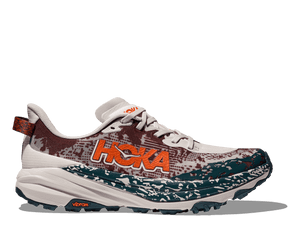 The Speedgoat 6 has a cream base for both the upper and midsole with a deep red pattern overlay on the upper and blue overlay on the midsole. 