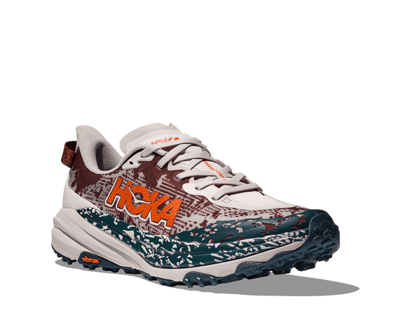 Hoka is printed in the middle on the lateral side of the upper in bright orange lettering. 