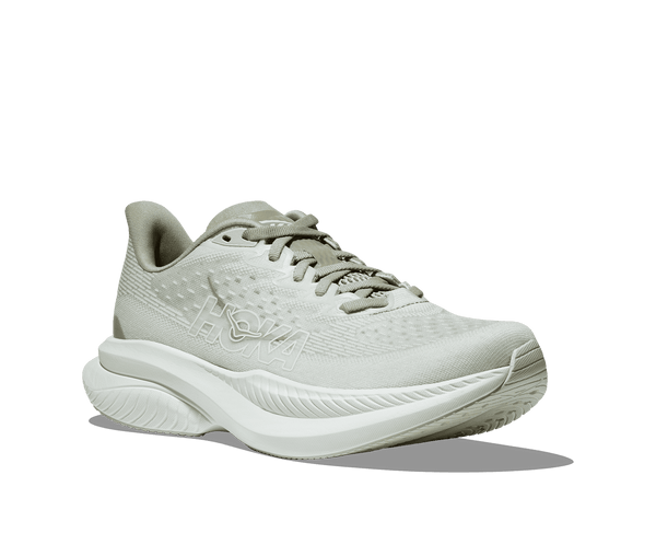 The Hoka brand name is outlined in white in the middle on the lateral side of the upper. 