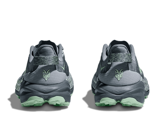 A heathered green and black pull tab is located on the heel. 