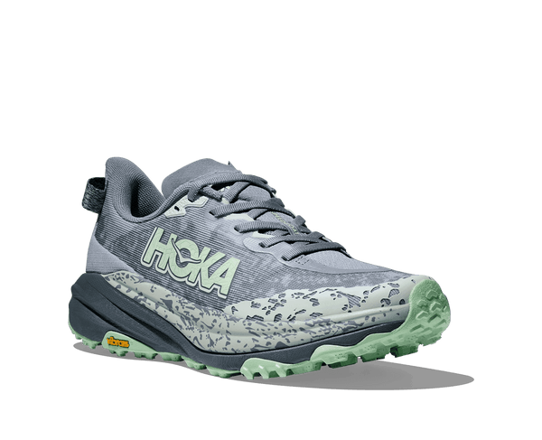 A light green patterned ovelay comes across the midsole and toe of the shoe. 