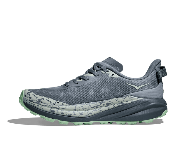A light green Hoka logo is printed near the ankle on the medial side of the upper. 