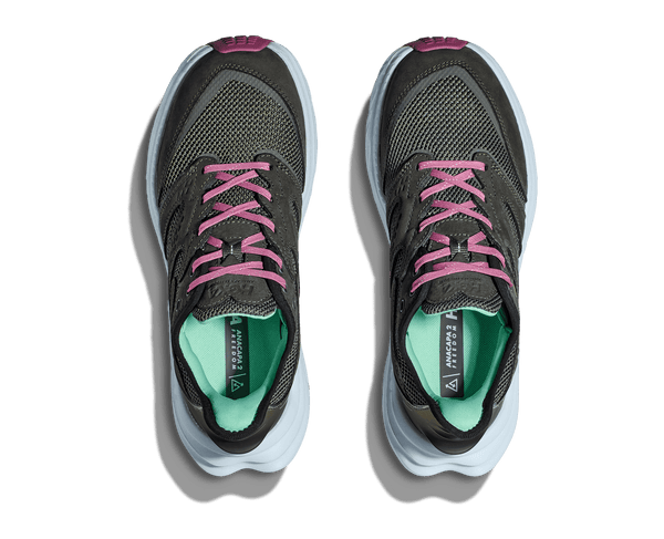 Pair of gray running shoes with pink laces on a transparent background