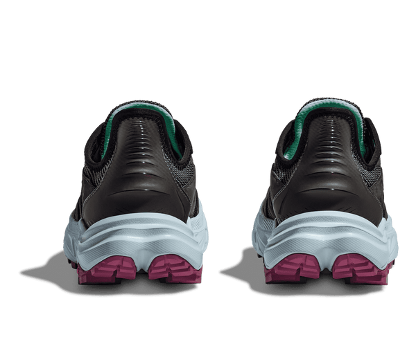 Black and gray athletic shoes with pink sole on a transparent background
