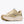 Cream and off-white running shoe on a white background