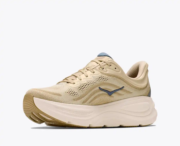 Cream and off-white running shoe on a white background