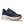 Navy running shoe with white sole on a transparent background