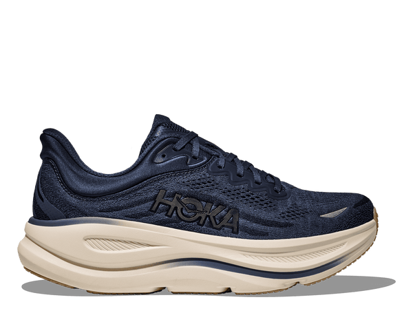 Navy running shoe with white sole on a transparent background