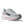 Gray running shoe with red accents on a transparent background