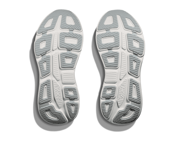 Close-up of the sole pattern of a pair of shoes on a green background
