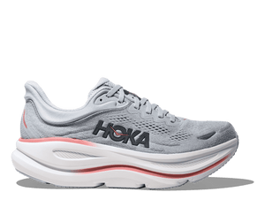 Gray running shoe with white sole and red accents on a transparent background