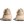 Pair of beige sneakers on a transparent background.