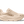 Beige running shoe with Hoka branding on a transparent background.