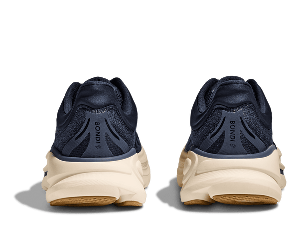Navy running shoes with white soles on a transparent background
