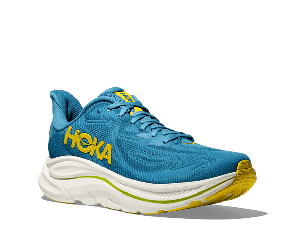 Hoka is stitched on the lateral side of the upper using yellow thread. 