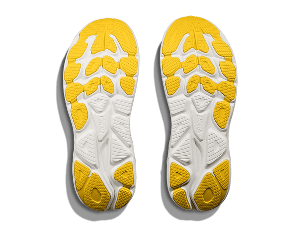 Yellow rubber is used on the outsole of the shoe to contrast the white midsole. 