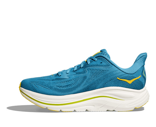 A yellow and green line runs through the middle of the white midsole. 