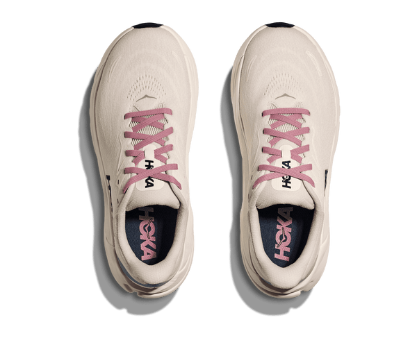 A birds-eye view of this shoe shows pink laces and a navy blue insole. 