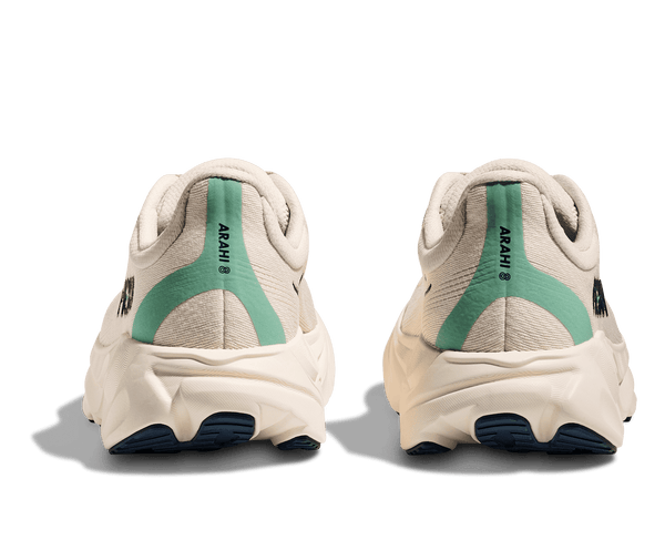 A teal band runs down the back of the shoe and around the heel. 