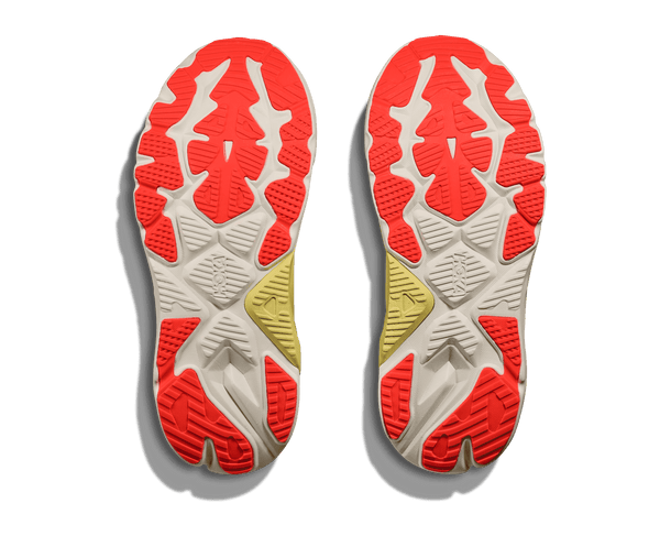 Close-up of red, white, and yellow outsole pattern of a Hoka Arahi 8.